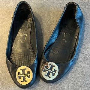 Very used Tory Burch black and gold size 7 1/2